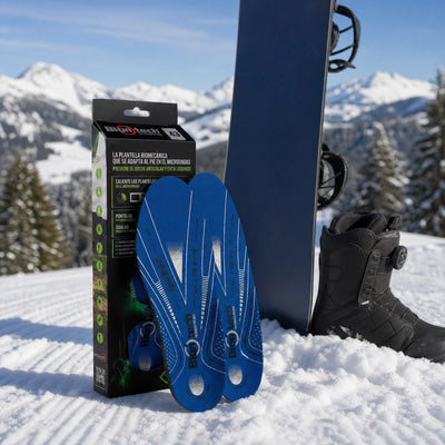 Plantillas Biontech Snow para snowboard con su caja y bota de snowboard en pista